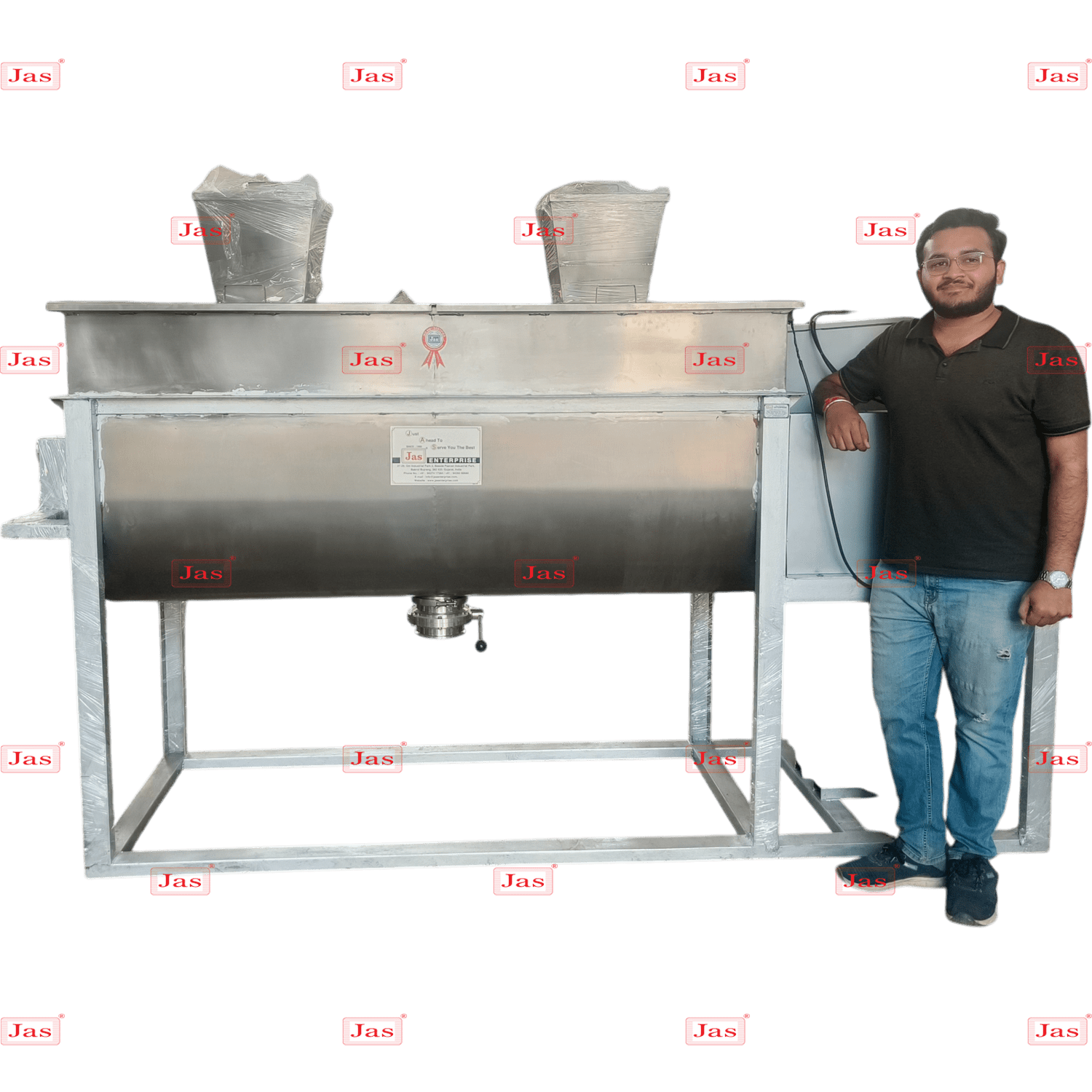 Large stainless steel industrial ribbon blender shown with a person for scale to demonstrate its high-volume mixing capacity.